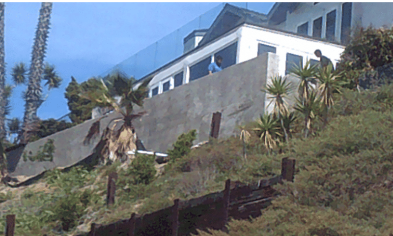 Retaining wall behind home on a hillside